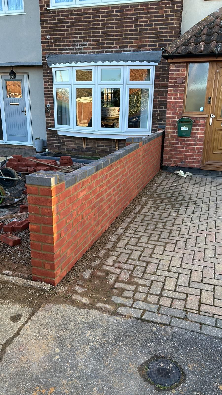 Newly laid block-paved pathway between properties