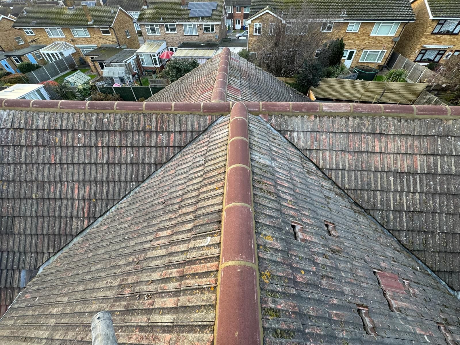 Close-up of a new grey tiled roof and ridge
