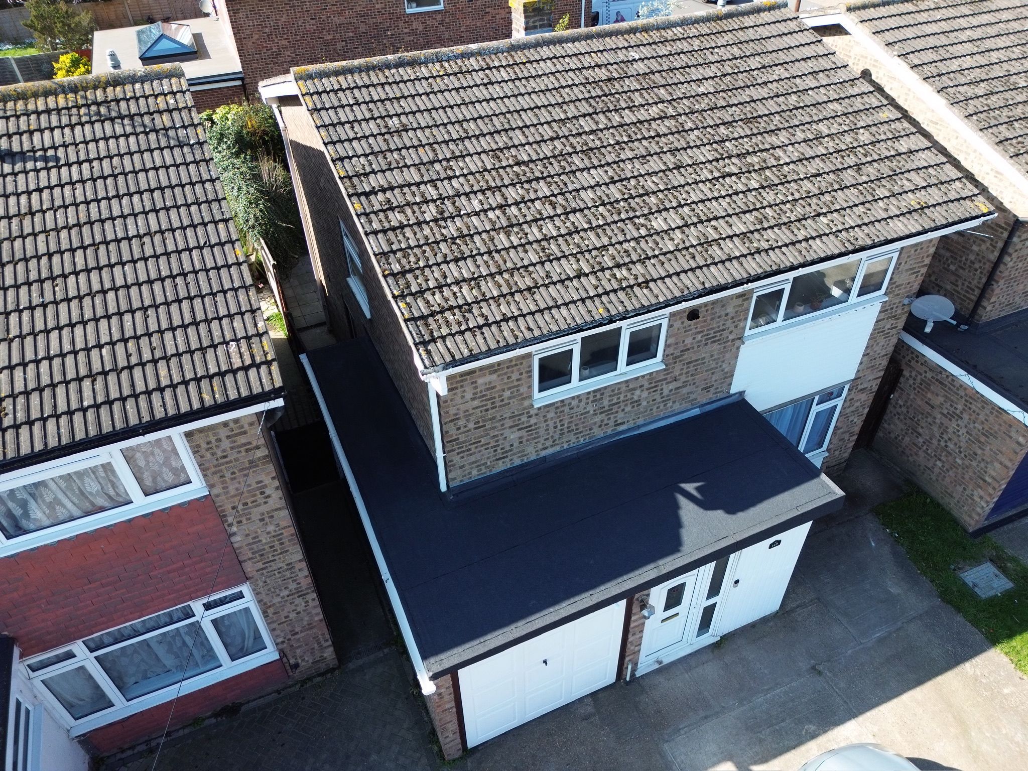 New grey GRP flat roof fitted over a garage